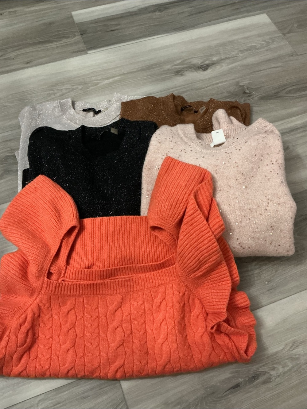 Five size medium sweaters